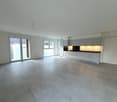 empty kitchen, grey tiled floor, white cabinets, double doors, sliding glass doors