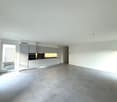Empty kitchen with modern design, open balcony, large windows, grey tiled floor