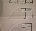 floor plan showing various rooms and spaces with a balcony marked on the 2nd floor