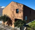 Modern brick house, large windows, garage, mountain view