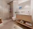 large mirror, double vanity, walk-in shower, white toilet, wooden stool with towels