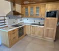 kitchen with tile floor, wooden cabinets, kitchen appliance, microwave, stove