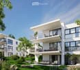 Modern 3-story white building, raised ground floor, large windows, multiple balconies