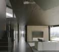 Long hallway, glass wall, white sofa, large windows, staircase