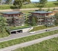 Modern apartment buildings with solar panels, ground level access, balconies, parking areas, and rooftop gardens