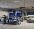 Industrial workshop with blue cabinets, workbenches, and overhead lighting.