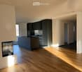 Kitchen. Modern kitchen with island, cabinets, sink, faucet, oven, and fireplace.