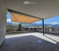 Balcony / Terrace. Balcony with tiled floor, metal railing, retractable awning, and scenic mountain view.