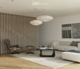 Modern living room with a fireplace, a sofa, a coffee table, an ottoman, a chair, and decorative artworks on the wall.