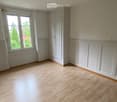 empty room, wooden floor, white walls, large window, white door