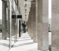 modern building, marble columns, glass walls, white floor, hanging lamps