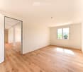 empty room, hardwood floors, white walls, natural light from window