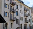 5 story building, balconies, fountain, bicycles parked
