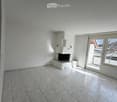 empty room, white walls, white tiles, fireplace, balcony