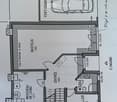 Floor plan showing a basement level with a garage, entrance, washing/heating area, and a cellar.