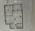 Floor plan of a residential building showing multiple rooms including living area, bedrooms, bathrooms, and kitchen.