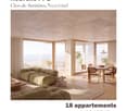 Modern living and dining area with large windows offering a scenic view, featuring a green sectional sofa, wooden coffee table, dining table with chairs, and floor lamp.