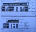Floor plan of a residential building showing multiple rooms, including living spaces, bedrooms, and bathrooms, with labeled dimensions and room names.