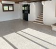Empty room with tiled floor, white walls, wooden ceiling beams, staircase leading to another level, and a fireplace area.