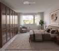 Modern bedroom with a large bed, nightstands, a round chair, a small table, a plant, and a tall wardrobe. The room features large windows with sheer curtains and a neutral color palette.