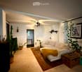 Modern living room with white walls, wooden floor, sectional sofa, coffee table, and decorative plants.