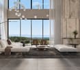 Modern living room with large windows offering a scenic view, featuring a white sectional sofa, ottoman, coffee table, floor lamp, and several chairs.