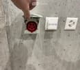 White electrical outlets mounted on a concrete wall