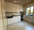 white kitchen with cabinets, sink, dishwasher, oven, granite countertops