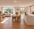Open-plan living and dining area with a modern kitchen, large windows offering a scenic view, and contemporary furniture including a sofa, dining table, and chairs.
