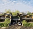 Modern two-story house with a contemporary design, featuring large windows, a raised ground floor, and a spacious outdoor area with seating and a dining table.