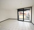 empty room, white tile floor, white walls, sliding glass door, balcony
