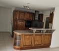 large modern kitchen, wooden cabinets, granite countertop, appliances, ceramic flooring