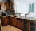 modern kitchen, granite countertops, stainless steel sink, dishwasher, wooden cabinets, granite backsplash