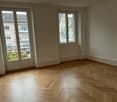 empty room, wooden parquet flooring, large windows, balcony