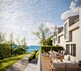Contemporary townhouse, modern architecture, terrace with outdoor seating, scenic view of the ocean and mountains, landscaped greenery, spacious outdoor area