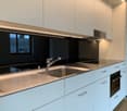 White cabinets, granite countertop, stainless steel sink, undermount sink, stainless steel faucet, modern kitchen appliances