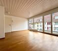 large windows, balcony, wooden floors, radiator, entry door