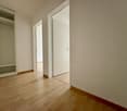 empty room, wooden floor, closet, two doorways