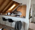 kitchen with bar counter, wooden beams, wooden cabinets, tiled floor, sink, stove, refrigerator, ceiling lamp, window