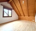 empty room, wooden ceiling, wooden floor, window, power outlets