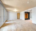 empty room, wooden parquet floor, white walls, wooden ceiling, large windows, wooden door, built-in wardrobe