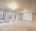 empty room, wooden parquet floor, wooden ceiling, sliding glass doors, wooden door