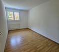 empty room, wooden floor, white walls, window, radiator