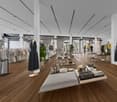 clothing racks, display tables, clothing mannequins, grey wooden flooring, white walls, lights on the ceiling