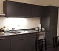 Kitchen with modern cabinets, granite countertops, stainless steel appliances, and a dishwasher.