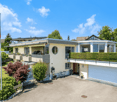 2 story house, terrace, balcony, garage, driveway, plants and shrubs