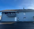 Blue house, two-story, modern style, terrace on the second floor, two garage doors