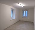 empty room, white walls, white ceiling, white tiled floor, white windows, radiator