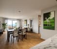 large windows, wood flooring, table, chairs, modern interior design