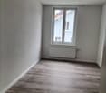 empty room, white walls, hardwood floor, white window, radiator
